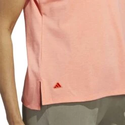 Adidas 2023 Women's Go-To Heathered Polo -Golf Equipment Store adidas 23 womens go to heathered polo coral fusion detail2 itempicture